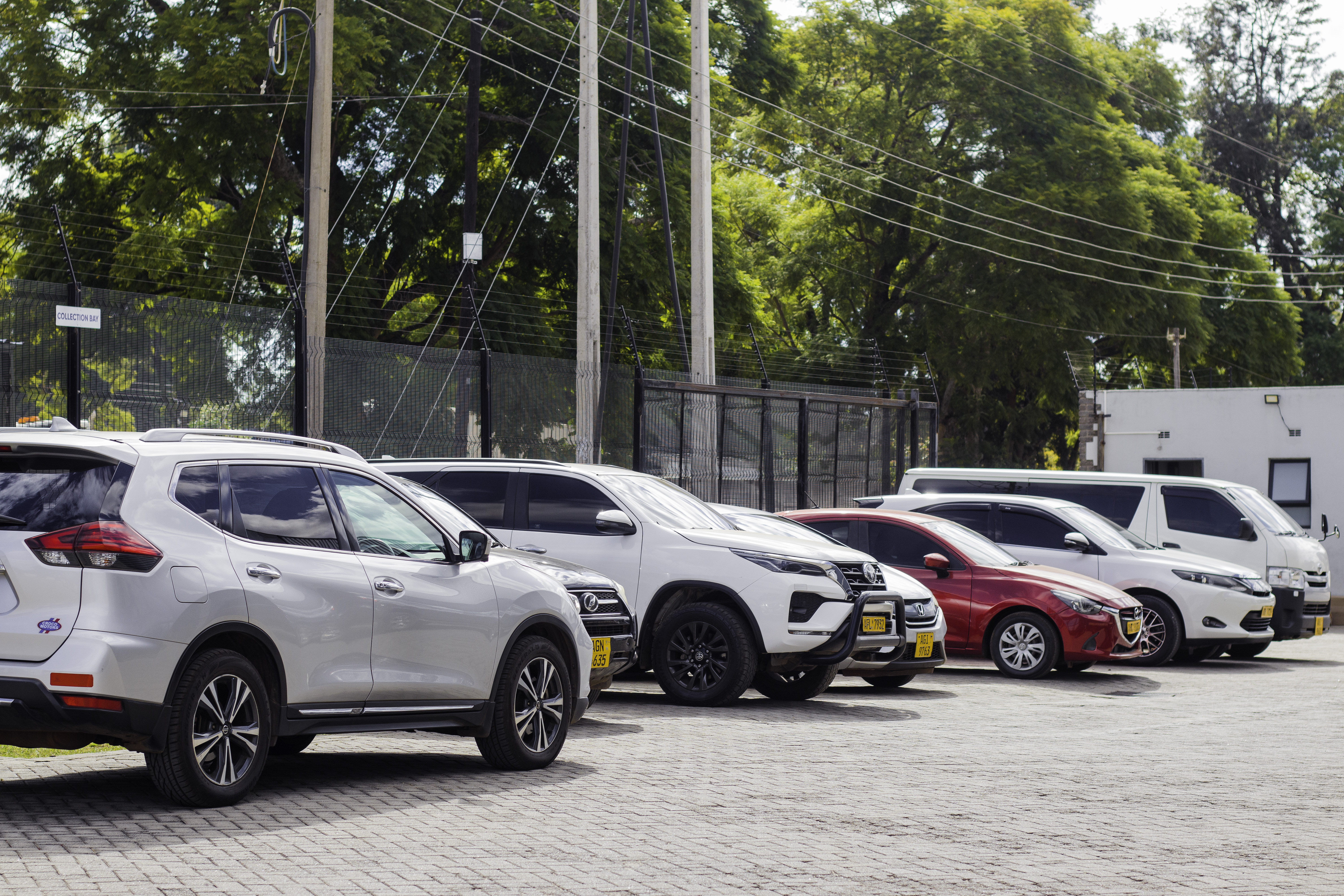 Vehicles parked outside Grand Auto Premier
