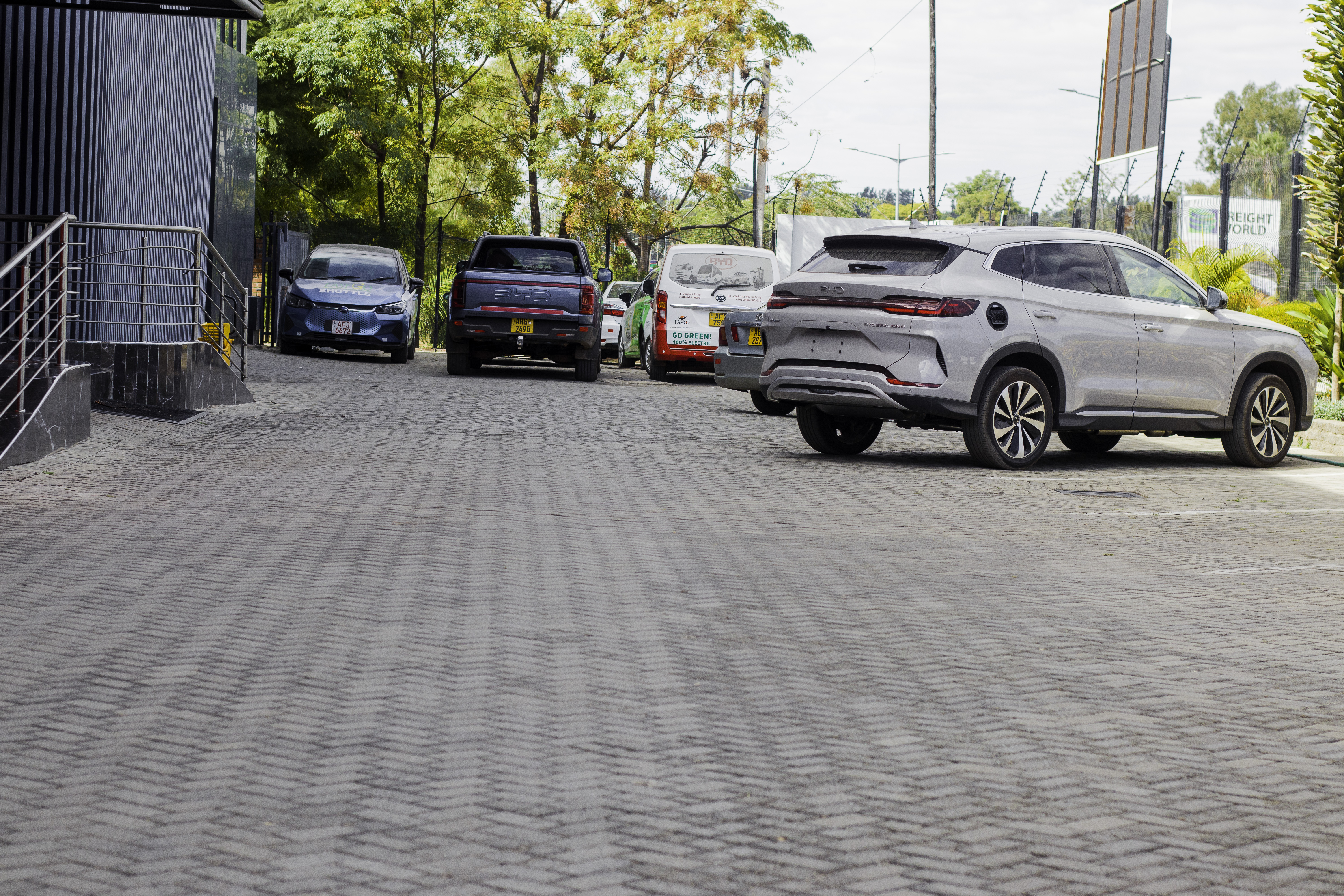 Grand Auto Premier workshop driveway with customer vehicles